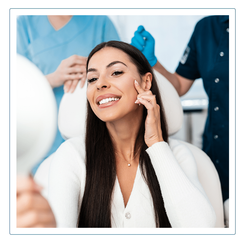 A woman checking her skin after PDO Thread Therapy